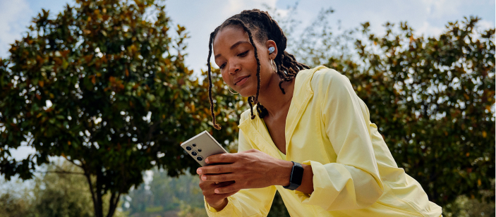 Woman with phone outside